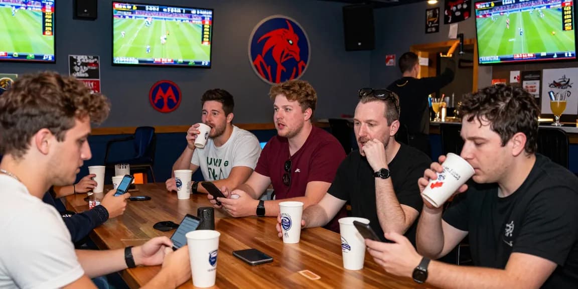 OPEN88 sports betting environment with enthusiastic bettors analyzing live game statistics and placing bets in a vibrant sports lounge.